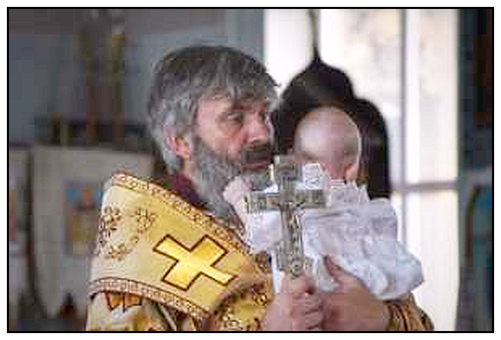 Metropolitan Kliment baptizing a baby