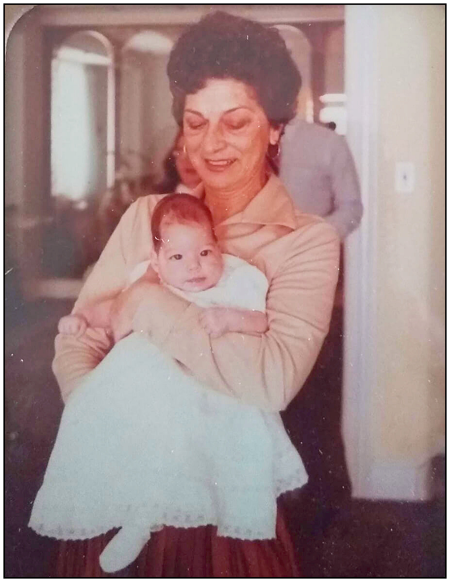 grandmother holding infant granddaughter